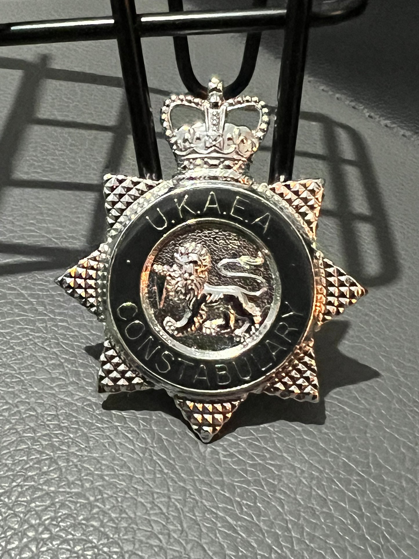 Black UKAEA Cap Badge "United Kingdom Atomic Energy Authority" Obsolete Police Collectible