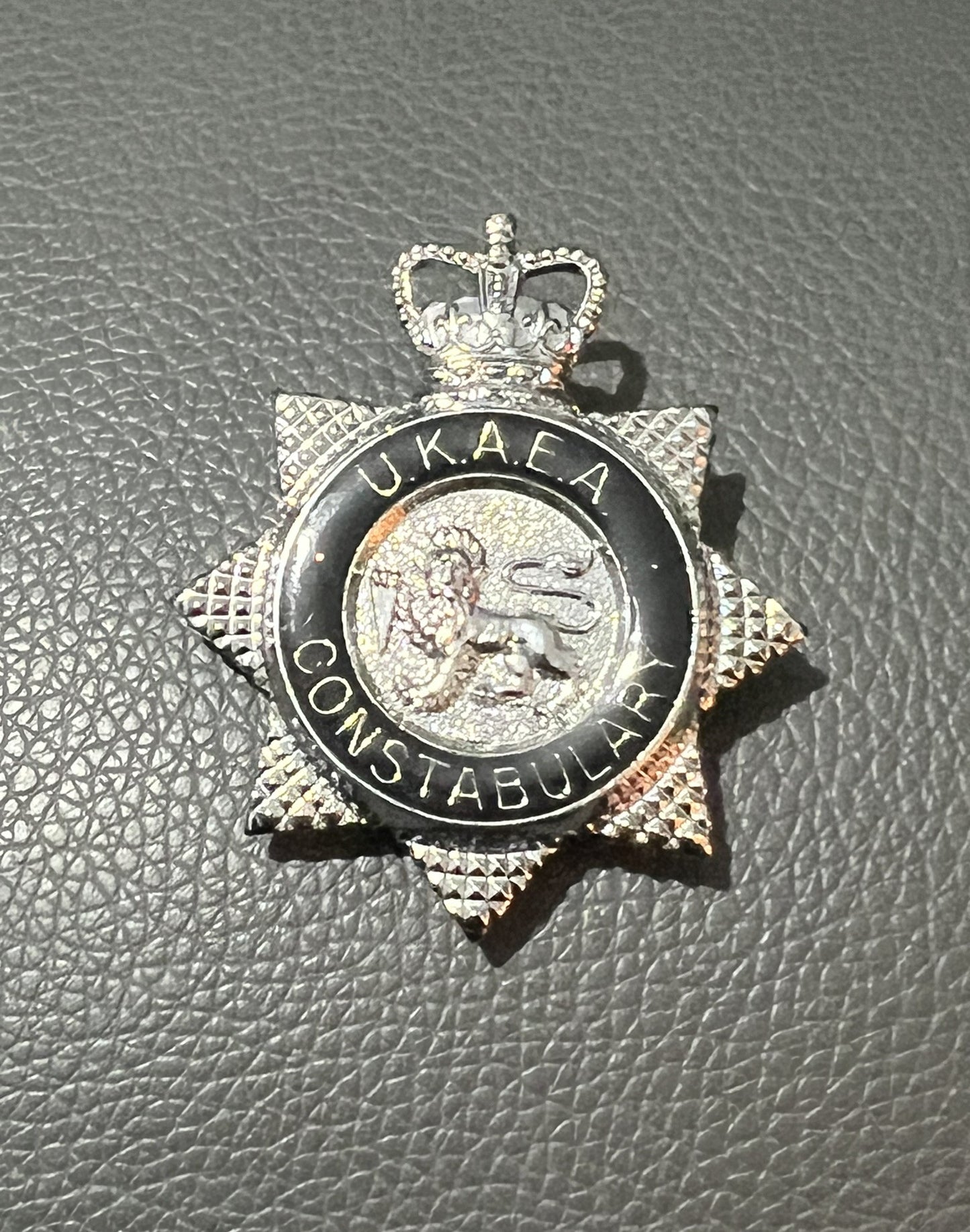 Black UKAEA Cap Badge "United Kingdom Atomic Energy Authority" Obsolete Police Collectible